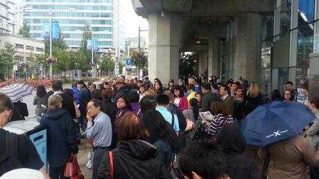 Passengers wait outside the Brighouse Canada Line station on Thursday morning. Canada Line outage
