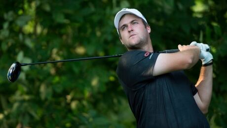 Taylor Pendrith from Richmond Hill, Ont. hits off the 18th tee during first round of play at the Canadian Open golf championship on Thursday. GLF Canadian Open 20140724