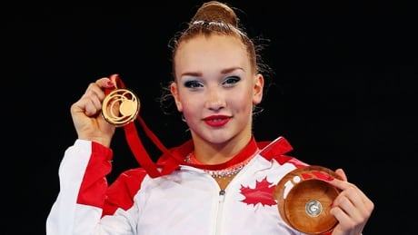 GLASGOW, SCOTLAND - JULY 26: Gold medalist Patrica Bezzoubenko of Canada on the podium during the medal ceremony for the Women’s Rhythmic Gymnastics Individual Ball final at SECC Precinct during day three of the Glasgow 2014 Commonwealth Games on July 26, 2014 in Glasgow, United Kingdom. bezzoubenko-patricia-140726