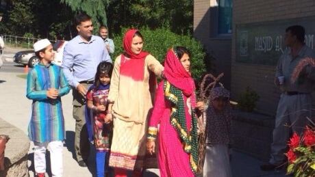 A family arrives at the Eid al-Fitr celebration at the Masjid Al Salaam Mosque in Burnaby. Eid celebrations