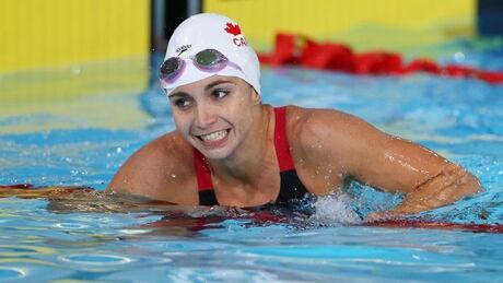 GLASGOW, SCOTLAND - JULY 28: Audrey Lacroix of Canada reacts after winning the gold medal in the Women's 200m Butterfly Final at Tollcross International Swimming Centre during day five of the Glasgow 2014 Commonwealth Games on July 28, 2014 in Glasgow, Scotland. lacroix-620