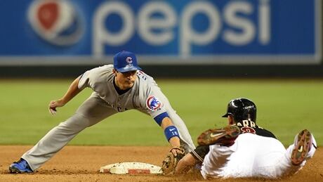 Darwin Barney, left, tied a major-league single season record in 2012 with 141 consecutive errorless games at second base. barney-darwin-140719