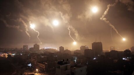 Israeli forces' flares light up the night sky of Gaza City on early Tuesday, July 29, 2014. A truce between Israel and Hamas militants in Gaza remained elusive as diplomats sought to end the fighting at the start of the Eid al-Fitr holiday, marking the end of the Muslim holy month of Ramadan. Mideast Israel Palestinians