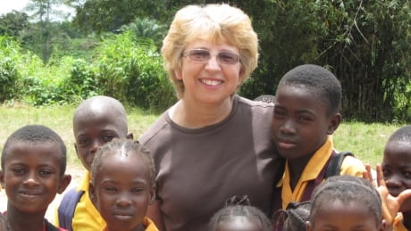 Nancy Writebol, a U.S. missionary, is shown here with children in Liberia in October 2013. Writebol is one of two Americans working for a missionary group in Liberia that have been diagnosed with Ebola. Ebola Americans