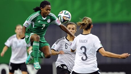 Loveth Ayila (7) of Nigeria leaps for the ball in the FIFA U-20 Women's World Cup final at Montreal's Olympic Stadium on Sunday. ayila-loveth-140824