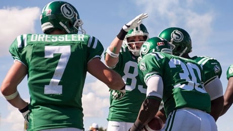 Saskatchewan Roughriders running back Will Ford (30) is congratulated by his teammates Weston Dressler (7), slotback Chris Getzlaf, centre back, and quarterback Darian Durant during Sunday’s CFL game against the Winnipeg Blue Bombers. dressler-ford