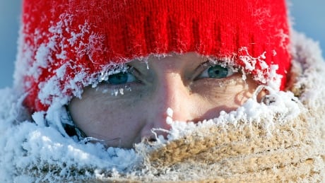Ice from the breath of Gail Davis forms around her face as she exercises by walking outside in Minneapolis, January 8, 2014. A deadly blast of arctic air shattered decades-old temperature records as it enveloped the eastern United States on Tuesday, snarling air, road and rail travel, driving energy prices higher and overwhelming shelters for homeless people. According to AccuWeather.com, the extreme cold won't last much longer. The frigid air and "polar vortex" that affected about 240 million people in the United States and southern Canada will depart during the second half of this week, and a far-reaching January thaw will begin, according to AccuWeather.com. USA-WEATHER/