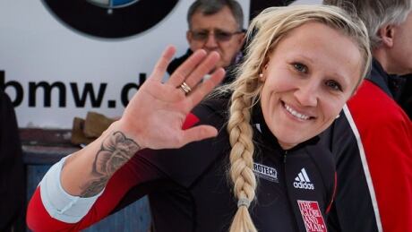 Canada’s Kaillie Humphries, waves after competing in the men's World Cup 4-man bobsled event in Calgary, Saturday, Dec. 20, 2014. humphries-kaillie-620