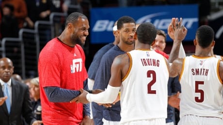 Cavaliers forward LeBron James, left, congratulates teammate Kyrie Irving (2), who scored a career-high 55 points against the Portland Trail Blazers Wednesday night. cavaliers-career