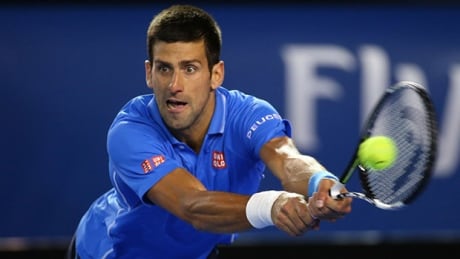 MELBOURNE, AUSTRALIA - JANUARY 30: Novak Djokovic of Serbia plays a backhand in his semifinal match against Stanislas Wawrinka of Switzerland during day 12 of the 2015 Australian Open at Melbourne Park on January 30, 2015 in Melbourne, Australia. djokovic-150130-620