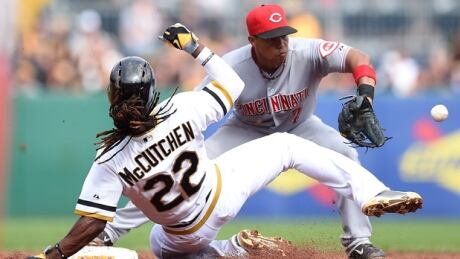 Ramon Santiago, right, a 13-year veteran infielder who played with the Cincinnati Reds last year has been signed and invited to spring training by the Blue Jays. Ramon Santiago