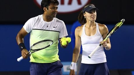 Martina Hingis of Switzerland and Leander Paes of India celebrate winning their final mixed doubles match against Kristina Mladenovic of France and Daniel Nestor of Canada during day 14 of the 2015 Australian Open at Melbourne Park on Sunday in Melbourne, Australia. Martina Hingis