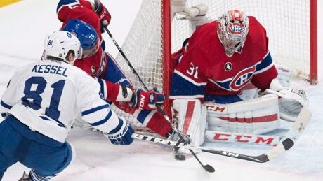 Montreal Canadiens goaltender Carey Price makes a save on Toronto Maple Leafs' Phil Kessel as Canadiens' P.K. Subban defends during overtime period NHL hockey action in Montreal, Saturday, February 14, 2015. price-kessel-620
