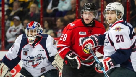 Owen Sound Attack forward Justin Brack (middle) has been suspended 10 games by the OHL for an illegal hit to the head against a Barrie Colts opponent. Justin Brack