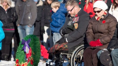 Veteran Paul Franklin, who lost both his legs in a suicide bombing in Kandahar, takes part in a moment of silence during the First Battalion Princess Patricia's Canadian Light Infantry Remembrance Day ceremony in Edmonton, Alberta on Monday November 11, 2013. THE CANADIAN PRESS/Jason Franson Veterans limbs Remembrance Day