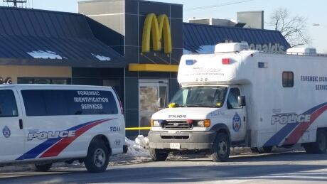 Toronto Police on scene at Danforth McDonald's after shooting left two men dead. Police mark off Danforth McDonald's after shooting