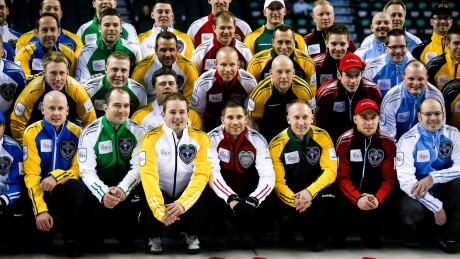 Players from 14 different teams gather for a group shot at the Brier in Calgary. CUR Brier 20150227