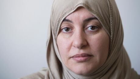 Wearing the Hijab when she went to court, Rania El-Alloul poses for a photograph at her home in Montreal, Saturday, February 28, 2015. A crowdfunding campaign in support of El-Alloul, who was refused her day in court because she was wearing a hijab, has raised more than $20,000 in its first day. THE CANADIAN PRESS/Graham Hughes Quebec Hijab Dispute Crowdfund 20150228