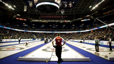 Team Canada skip John Morris, centre, watches the action at the Brier in Calgary on Saturday. CUR Brier 20150228