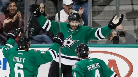 Erik Cole (centre) is on his way from the Dallas Stars to the Detroit Red Wings in a trade announced on Sunday. ERIK COLE