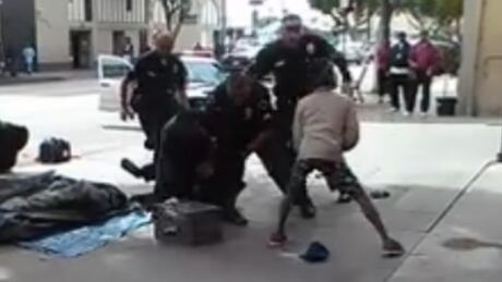 A still from video shows Los Angeles police shooting a man during a confrontation in the skid row area. L.A. police shooting