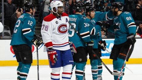 Patrick Marleau #12, Logan Couture #39, Joe Pavelski #8 and Brent Burns #88 of the San Jose Sharks celebrate Pavelski's goal as P.K. Subban #76 of the Montreal Canadiens looks on at the SAP Center on March 2, 2015 in San Jose, CA . pk-subban