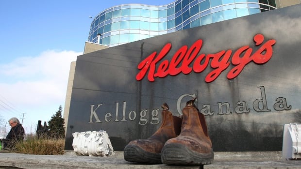 Discarded work boots rest in front of the Kellogg's Canada sign at the Kellogg's plant in London, Ont., on Monday, Dec. 22, 2014. The staff gathered one last time for a lunch on the final day of work, as the plant closes after a 107 year history of producing cereal. THE CANADIAN PRESS//Dave Chidley