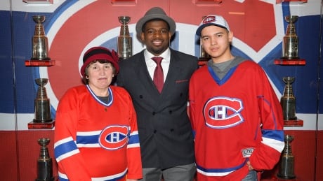 Izaiah Clyke (far right) got to meet Montreal Canadiens star player P.K. Subban (centre) thanks to the efforts of his grandmother, Karen Porter, who took him on a trip to Montreal as a result of winning a raffle. Karen Porter, P.K. Subban and Izaiah Clyke