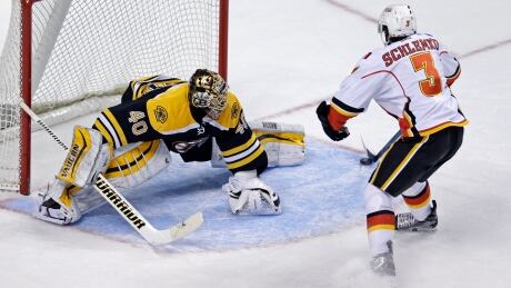 Calgary Flames defenceman David Schlemko fakes out Boston Bruins goalie Tuukka Rask as he tucks the puck behind Rask to score during the game in Boston, Thursday. David Schlemko