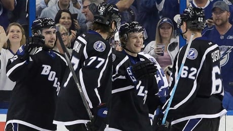 Tampa Bay Lightning center Vladislav Namestnikov, of Russia, second from right, celebrates his goal against the Toronto Maple Leafs with teammates Cedric Paquette, left, Victor Hedman, second from left, and Andrej Sustr, right, during the third period of an NHL hockey game Thursday, March 5, 2015, in Tampa, Fla. leafs-lose