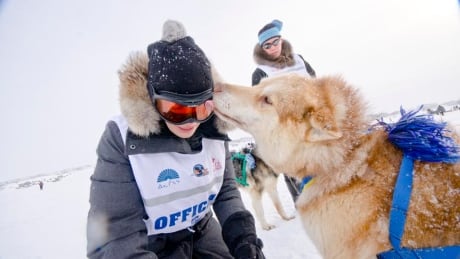 A race official gets a little love from a participant in the 2015 Ivakkak sled dog race near Umiujaq, Nunavik. The Ivakkak ended yesterday in Puvirnituq. Ivakkak March 20