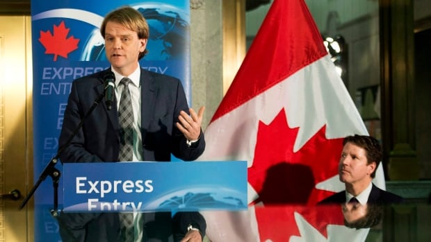 Immigration Minister Chris Alexander, shown here giving an update on the express entry last month in Toronto, has said the new immigration system was getting  "impressive results" in its first month.