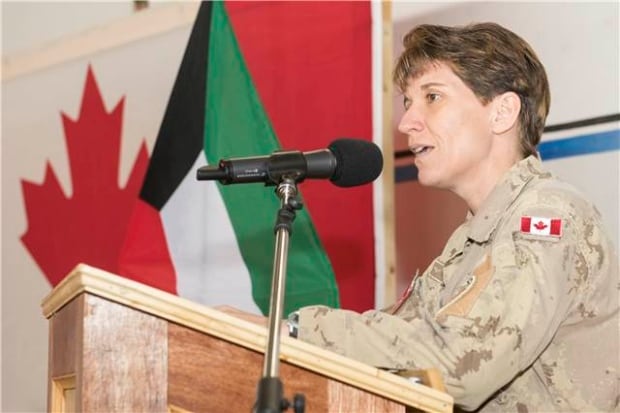 Brigadier General Lise Bourgon speaks at the change of command ceremony in Kuwait today.