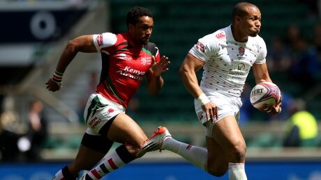 England's Marcus Watson is on his way to scoring a try vs. Kenya at the London Sevens rugby tournament. Canada won twice Saturday to advance to Sunday's quarter-finals. England-rugby
