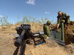 Canadian soldiers use sandbags, wire and metal siding to build a defensive position in the dirt surrounding CFB Wainwright, east of Edmonton, where 6,750 Canadians are training alongside American and British troops. 