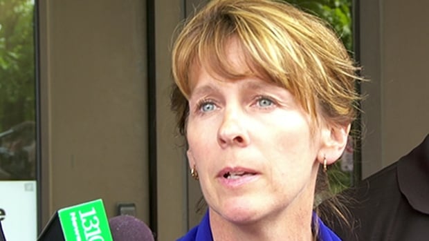 Bryan Casey's widow, LeeEllen Carroll, speaks to reporters outside the Elgin Street courthouse in Ottawa on May 29, 2015, after Christy Natsis is found guilty of impaired driving causing her husband's death.