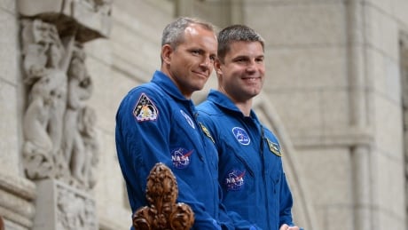 Canadian astronauts Jeremy Hansen (right) and David Saint-Jacques stand in the visitors gallery after being recognized in the House of Commons in Ottawa Tuesday. The two astronauts will finally have a chance to fly to space in the next decade. Jeremy Hansen David Saint-Jacques