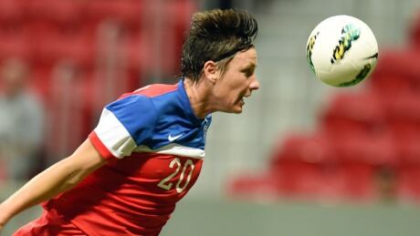 US player Abby Wambach heads the ball during their Brasilia International Tournament football match against Argentina at Mane Garrincha Stadium in Brasilia, on December 18, 2014. wambach-abby-620