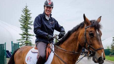 Ian Millar, from Perth, Ont., a Canadian equestrian team athlete in show jumping, rides his horse Baranus. EQU Pan Am Millar 20150617