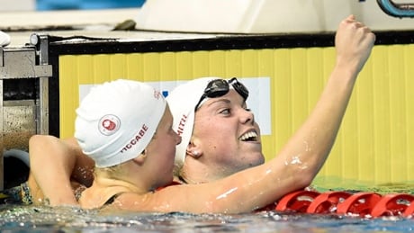 Teammates Kierra Smith(right) finished first and third in qualifying for the finals of the 200m breastroke, and finished first and second in the finals. APW1146756