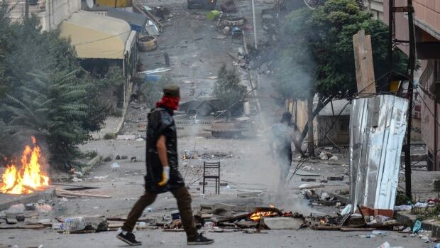 Makeshift barricades fill the streets as left-wing protesters demonstrate against Turkey's operation against Kurdish militants.