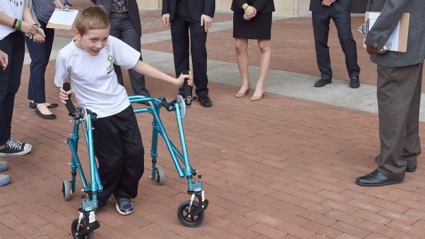 Braden Gandee, 8, who has cerebral palsy, tries out a new customized walker in Ann Arbor, Mich. An estimated 50,000 Canadian children and adults have the condition, which leads to varying degrees of motor impairment, including muscle spasticity and involuntary movements.