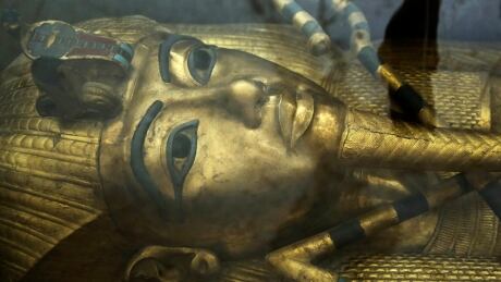 The coffin of King Tut is displayed in a glass case at the Valley of the Kings in Luxor, Egypt, Tuesday, Sept. 29, 2015. Egypt's antiquities minister said King Tut's tomb may contain hidden chambers, lending support to a British Egyptologist's theory that a queen may be buried in the walls of the 3,300 year-old pharaonic mausoleum. Mideast Egypt Antiquities