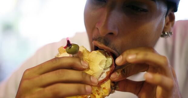 Eating a cheeseburger