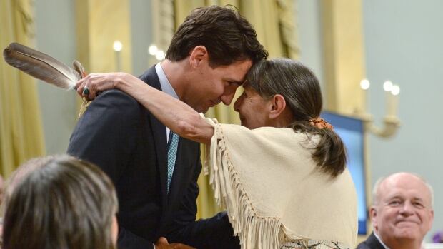 Liberal LeaderJustin Trudeau hugs Elder Evelyn Commanda-Dewache, a residential school survivor, during the closing ceremony of the Indian Residential Schools Truth and Reconciliation Commission, at Rideau Hall in Ottawa on Wednesday, June 3, 2015.
