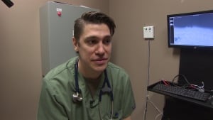 Veterinarian Gared Cantin looks after dog shot with arrow