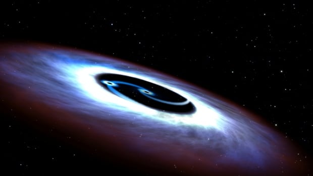 Markarian 231, a binary black hole found in the center of the nearest quasar host galaxy to Earth, is seen in a NASA illustration. Researchers have detected gravitational waves coming from two black holes that orbited one another, spiralled inward and smashed together.
