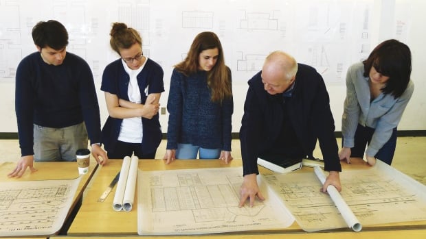 Waterloo Architecture students Alexandru Vilcu, Siobhan Allman, Anna Longrigg, and Piper Bernbaum review the Auschwitz Crematorium evidence plans with Waterloo Architecture Professor and The Evidence Room Co-Principal Robert Jan van Pelt.