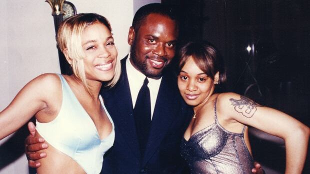 L.A. Reid is flanked by Tionne "T-Boz" Watkins and Lisa "Left Eye" Lopes of TLC.