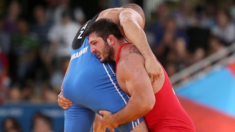 Georgia's olympic silver medallist Davit Modzmanashvili, right, admitted to using the banned substance meldonium, in which he tested positive for last month. modzmanashvili-davit-120811